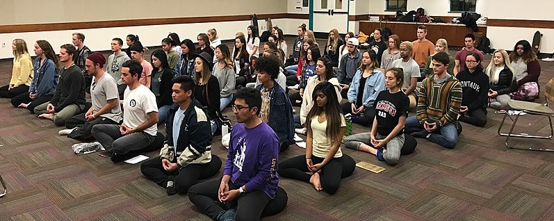 Photo of group of students meditating